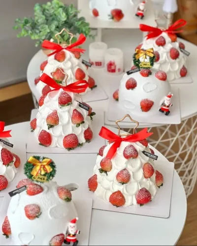 Christmas homemade cream cake with festive decorations and whipped cream frosting