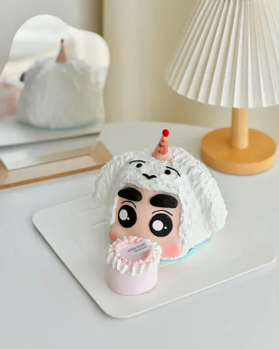 Shin Chan cartoon-themed birthday cake with colorful fondant design