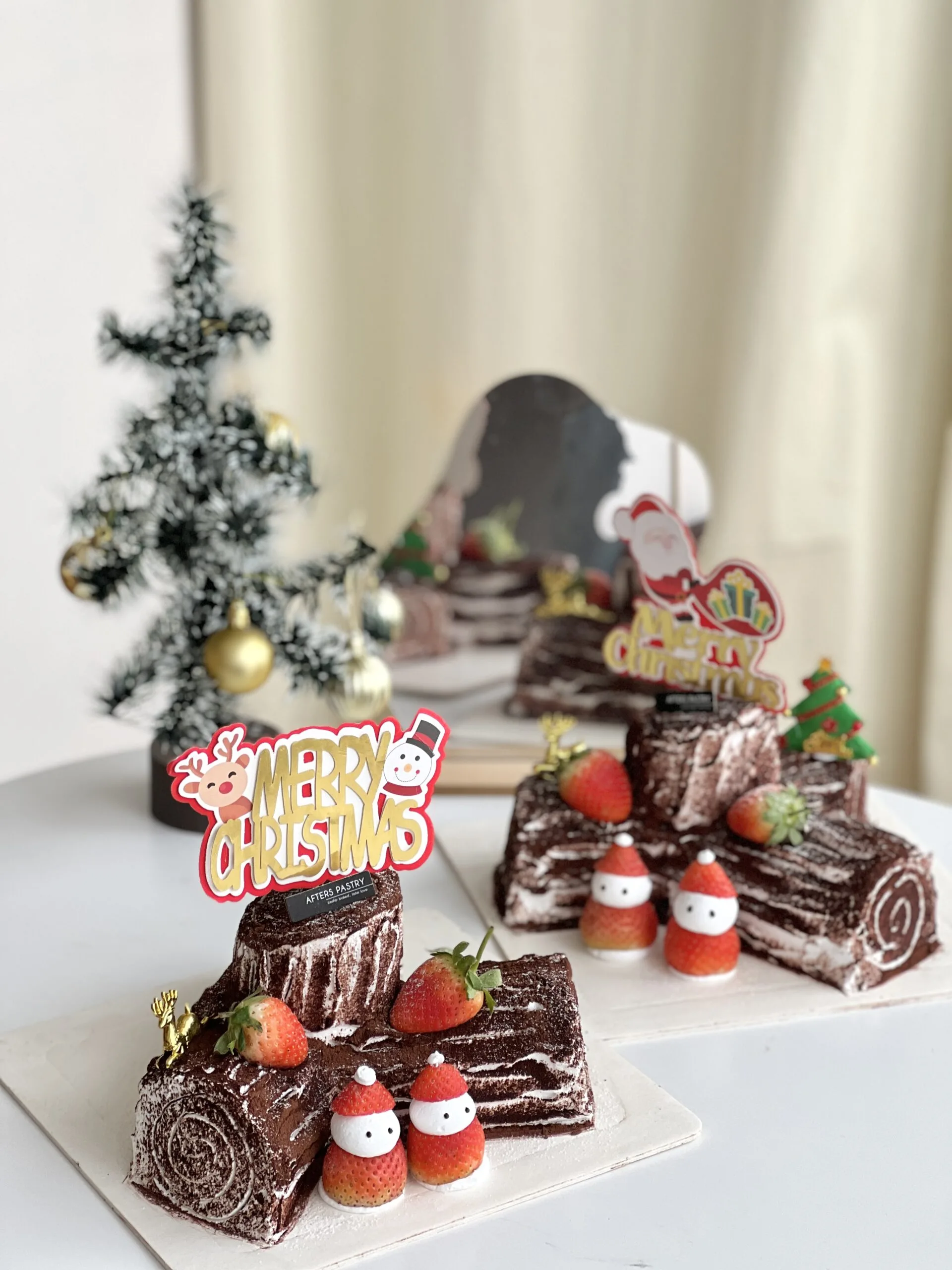 Christmas Chocolate Roll Cake with festive toppings and rich ganache