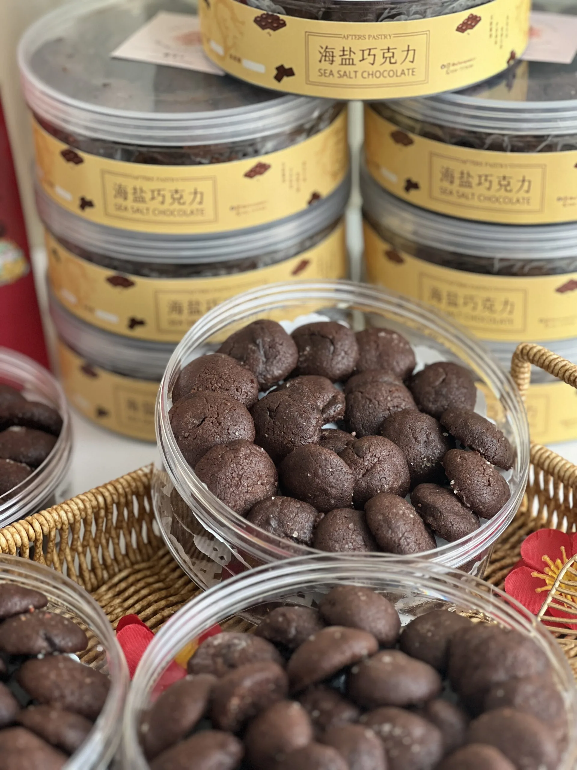 Jar of rich seasalt chocolate cookies topped with flaky salt from Afters Pastry