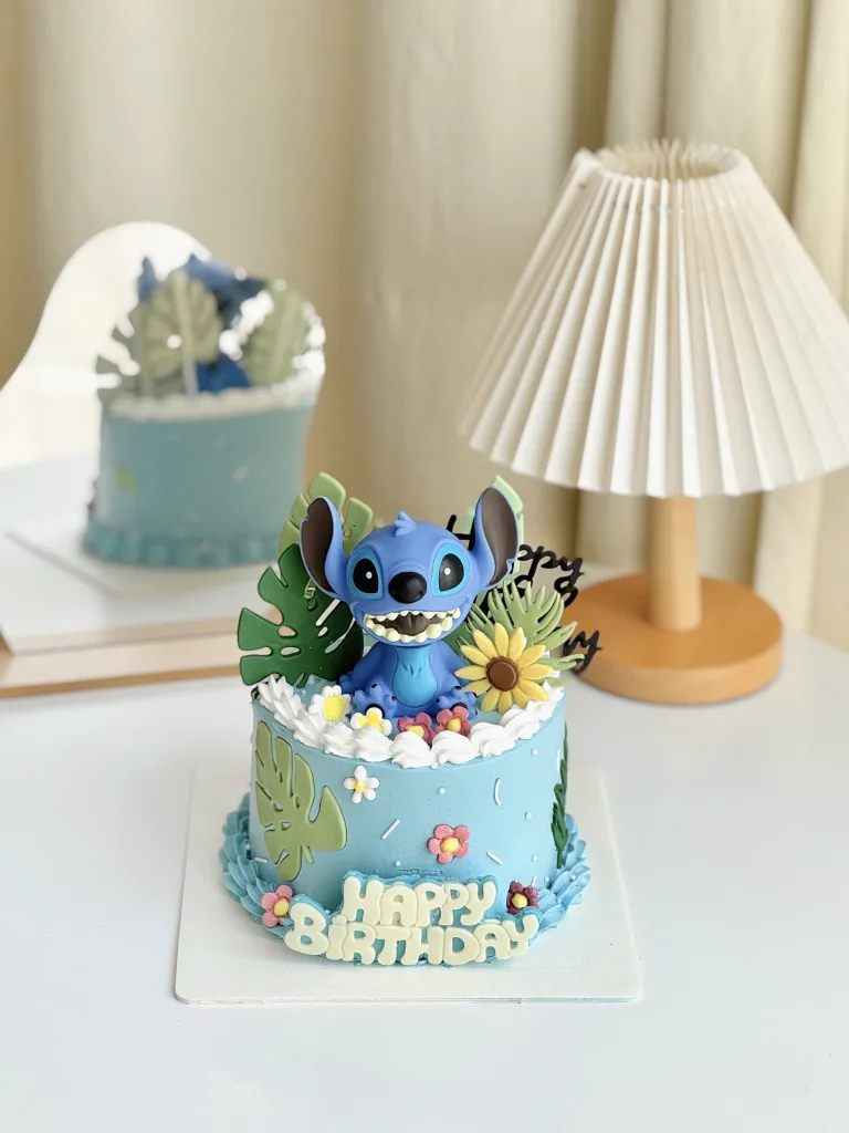 Lilo and Stitch themed birthday cake with tropical decorations