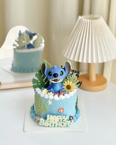 Lilo and Stitch themed birthday cake with tropical decorations