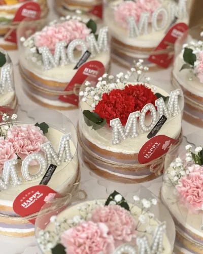 Mother’s Day naked cake with pink carnations and MOM pearl topper in clear dome box