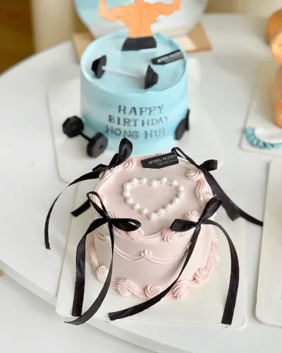 Elegant ribbon cake with fondant bows and pastel colours