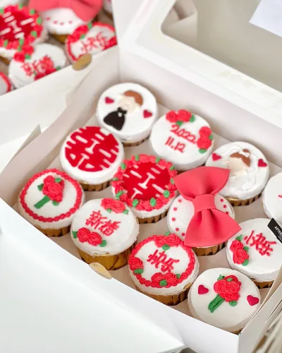 Elegant custom wedding cupcakes with white frosting and florals