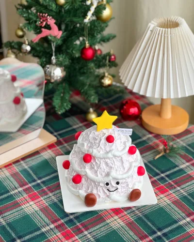 Christmas Tree Cake with vanilla, black sesame, chocolate, matcha, and lemon flavours in festive tree design
